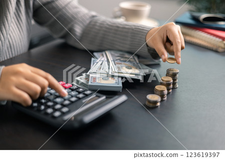 Finance bank tax expense accounting budget money businessman hand use calculator Financial calculate accountant close up calculator with graph chart write office desk Business expense analysis saving Finance bank tax expense accounting budget money businessman hand use calculator Financial calculate accountant close up calculator with graph chart write office desk Business expense analysis saving 123619397