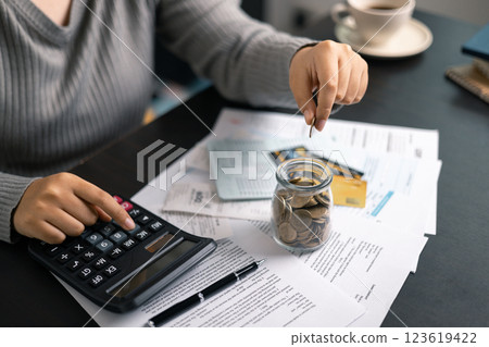 Finance bank tax expense accounting budget money businessman hand use calculator Financial calculate accountant close up calculator with graph chart write office desk Business expense analysis saving Finance bank tax expense accounting budget money businessman hand use calculator Financial calculate accountant close up calculator with graph chart write office desk Business expense analysis saving 123619422