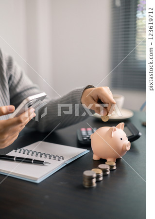 Finance bank tax expense accounting budget money businessman hand use calculator Financial calculate accountant close up calculator with graph chart write office desk Business expense analysis saving Finance bank tax expense accounting budget money businessman hand use calculator Financial calculate accountant close up calculator with graph chart write office desk Business expense analysis saving 123619712