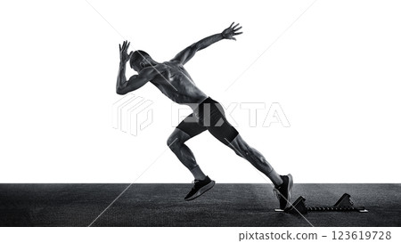 Sporty young man runner, quickly breaks away from start to be first to reach finish line against white studio background. 123619728