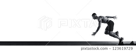 Banner. Side view full length portrait of young sportsman, professional runner runs up quickly against white background with negative space. 123619729