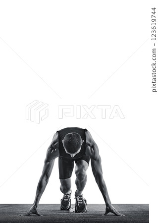 Front view of young athletic man, sportsman, sprinter standing on starting line ready to run against white background. Monochrome photo. Front view of young athletic man, sportsman, sprinter standing on starting line ready to run against white background. Monochrome photo. 123619744