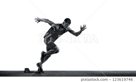 Dynamic photo of young sportsman, sprinter running from start line against white background. Monochrome photo. 123619746