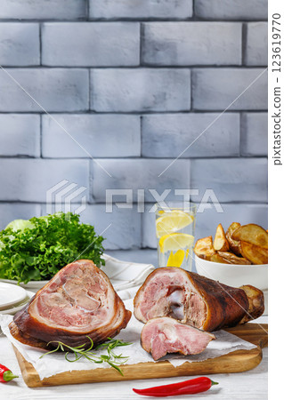 Smoked pork knuckle, ham hock on cutting board Smoked pork knuckle, ham hock on cutting board 123619770