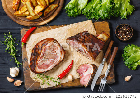 Smoked pork knuckle, ham hock on cutting board 123619772
