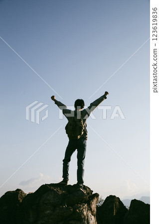 Man traveler with camera backpack hiking outdoor travel lifestyle and adventure concept. cap backpack and join of tourist for green mountain tour, beauty of nature and expansive sky people of tourism 123619836