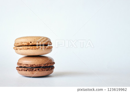 Stack of two brown French Macarons, cakes with coffee and creme brulee flavor Stack of two brown French Macarons, cakes with coffee and creme brulee flavor 123619962