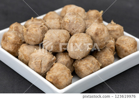 The cooked beef meatballs left out for a long time made the outer skin look unappetizing in a white dish. The cooked beef meatballs left out for a long time made the outer skin look unappetizing in a white dish. 123619976