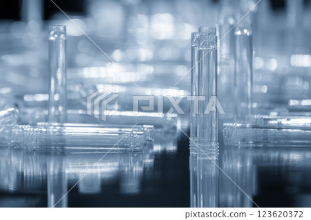 The plastic medical tube parts from  injection machine in the light blue scene. 123620372