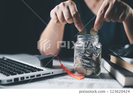 Saving money coin with banking investment, finance education concept. Planning student loan for studying abroad for college or university degree. Future children's education fund cash. Growing 123620424
