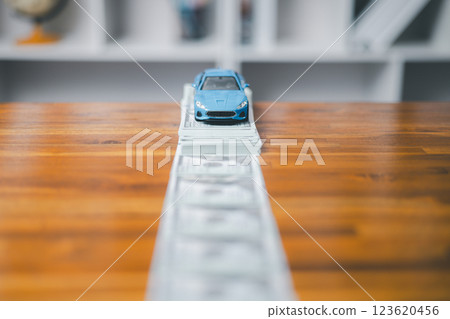 Car loan,money, banknote on agreement document or car insurance application form. Saving money for car concept, trade car for cash concept, finance concept. 123620456