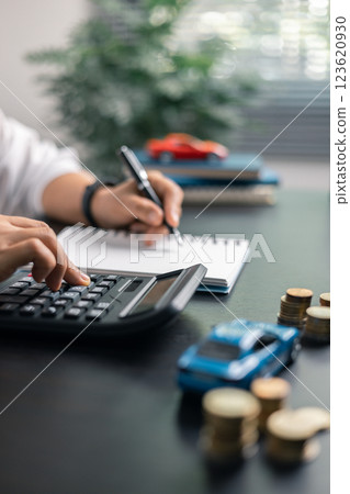 Finance bank tax expense accounting budget money businessman hand for Business expense analysis saving use car Financial calculate accountant close up calculator with graph chart write office desk Finance bank tax expense accounting budget money businessman hand for Business expense analysis saving use car Financial calculate accountant close up calculator with graph chart write office desk 123620930