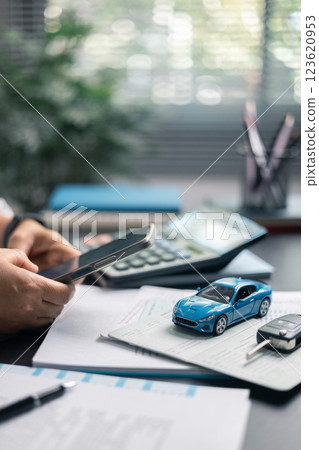 Finance bank tax expense accounting budget money businessman hand for Business expense analysis saving use car Financial calculate accountant close up calculator with graph chart write office desk 123620953
