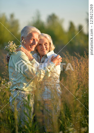 Loving mature couple in the park in summer Loving mature couple in the park in summer 123621269