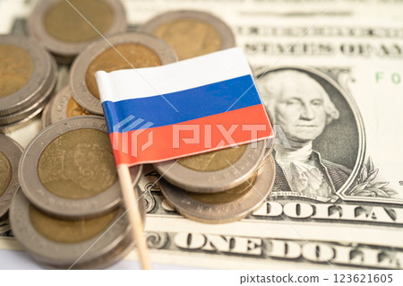 Stack of coins with Russia flag and US dollar banknotes. 123621605