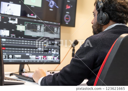Security guard watching video monitoring surveillance security system Security guard watching video monitoring surveillance security system 123621665