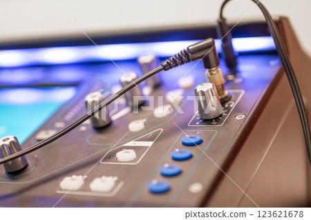 Sound engineer using digital audio mixer sliders Engineer pressing keys adds control panel volume Sound engineer using digital audio mixer sliders Engineer pressing keys adds control panel volume 123621678