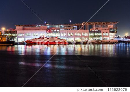 Night view of the Outer Harbour Ferry Terminal building in Macau, China. It provides ferry services to Hong Kong. Night view of the Outer Harbour Ferry Terminal building in Macau, China. It provides ferry services to Hong Kong. 123622076