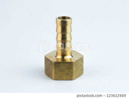 A brass connector, brass pipe fitting isolated. High quality photo A brass connector, brass pipe fitting isolated. High quality photo 123622989