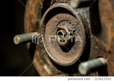 Close-Up Detailed View of Rusted Automotive Wheel Hub and Lug Bolts Close-Up Detailed View of Rusted Automotive Wheel Hub and Lug Bolts 123623503