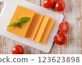 Sheddar cheese slices and tomatoes closeup. 123623898