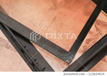dirty glass with greasy spots was removed from the oven door to clean it. dirty glass with greasy spots was removed from the oven door to clean it. 123624624
