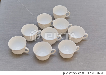 empty white cups on the table empty white cups on the table 123624631