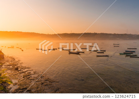 Ocean with boats and warm sunlight at Lembongan, Bali. Algae farm with a lot of boat Ocean with boats and warm sunlight at Lembongan, Bali. Algae farm with a lot of boat 123624715