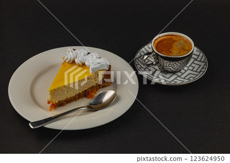 Delightful dessert plate featuring creamy cheesecake and espresso beverage Delightful dessert plate featuring creamy cheesecake and espresso beverage 123624950