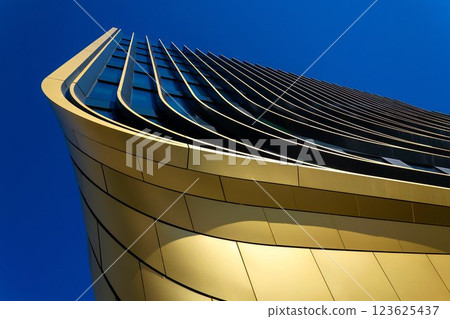 Masarycka office and retail building by Zaha Hadid Architects with golden facade on March 5, 2025 in Prague, Czech Republic. 123625437