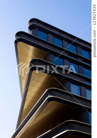 Masarycka office and retail building by Zaha Hadid Architects with golden facade on March 5, 2025 in Prague, Czech Republic. 123625439