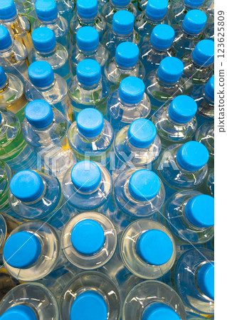 batch of water bottles with blue caps batch of water bottles with blue caps 123625809