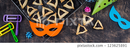 Jewish holiday Purim with carnival mask and cookies Hamantaschen 123625891