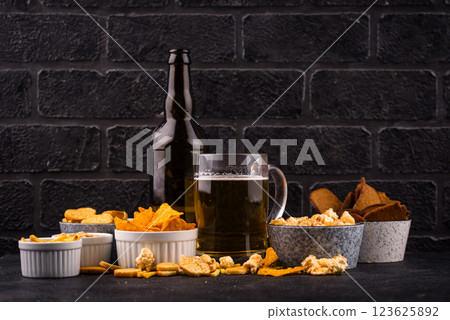 Beer and different snacks for Superbowl or football party Beer and different snacks for Superbowl or football party 123625892