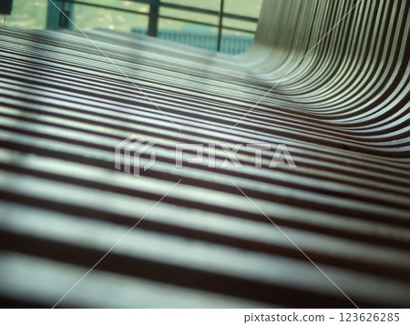 Close-up of wooden bench seat with selective focus and perspective distortion Close-up of wooden bench seat with selective focus and perspective distortion 123626285