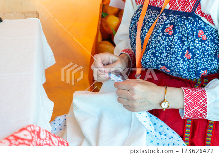 Traditional Russian Folk Embroidery - Woman Embroidering a Traditional Pattern Traditional Russian Folk Embroidery - Woman Embroidering a Traditional Pattern 123626472