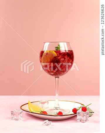 Royal lemonade cocktail with tequila, gin, rum, vodka, ice and fresh raspberry, bar and party concept, restaurant and cafe advertising card, elegant background, selective focus. 123626626