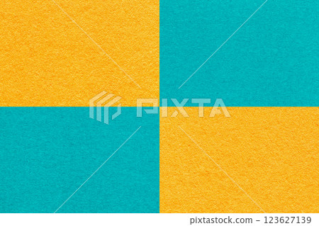 Texture craft yellow and cerulean paper background with cells pattern, macro. Structure vintage turquoise cardboard. Texture craft yellow and cerulean paper background with cells pattern, macro. Structure vintage turquoise cardboard. 123627139