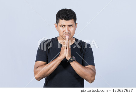 People putting hands together asking please, worried man apologizing, Hopeful man asking for help or apologizing, man thanking for forgiveness, Man asking please 123627657