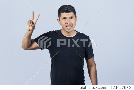 Smiling people showing ok gesture looking at camera, Person gesturing everything is ok, young man making ok gesture, expression of everything is fine. Smiling people showing ok gesture looking at camera, Person gesturing everything is ok, young man making ok gesture, expression of everything is fine. 123627670