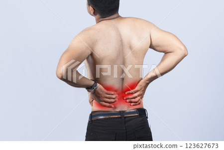 Person with back problems on isolated background, lumbar problems concept, A man with spine problems, a sore person with back pain 123627673
