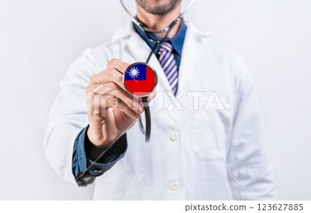Taiwan healthcare system, doctor holding stethoscope. Taiwan health and medical insurance concept Taiwan healthcare system, doctor holding stethoscope. Taiwan health and medical insurance concept 123627885