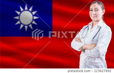 Female Doctor On Taiwanese Flag. Doctor With Crossed Arms On Taiwanese Flag. Taiwan Health And Care Concept 123627892