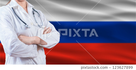 Doctor With Crossed Arms On Russian Flag. Russia Health And Care Concept. Female Doctor On Russian Flag 123627899