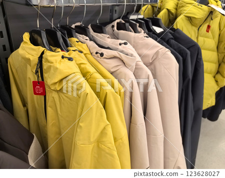 Vibrant jackets display in a cozy retail corner during autumn season 123628027