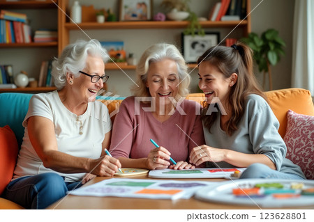 Three Generations of Women Enjoying Art and Creativity Together in a Cozy Living Room Three Generations of Women Enjoying Art and Creativity Together in a Cozy Living Room 123628801