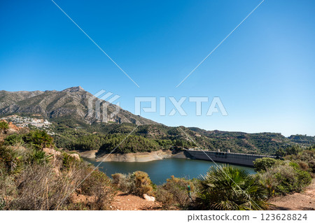 Scenic reservoir in mountainous landscape under clear blue sky, La Concepcion reservoir in Marbella Scenic reservoir in mountainous landscape under clear blue sky, La Concepcion reservoir in Marbella 123628824