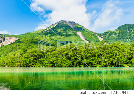 Summer in Kamikochi: View of Mount Yakedake from Taisho Pond 123629433