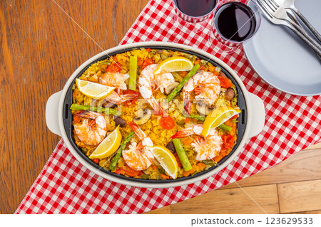 Paella is a typical Spanish rice dish. Paella is a typical Spanish rice dish. 123629533