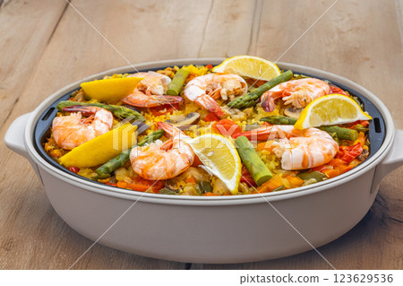 Paella is a typical Spanish rice dish. Paella is a typical Spanish rice dish. 123629536